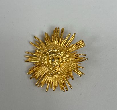 RMN 
Set of two engraved gilt metal brooches...