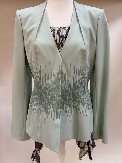 Thierry Mugler
Ice-blue polyester suit featuring...