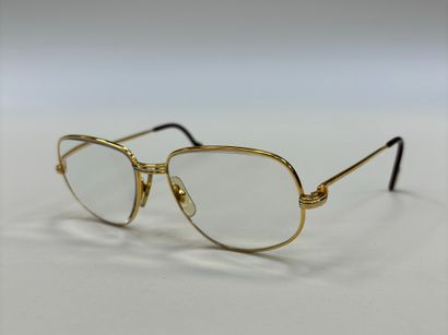 Cartier
Pair of glasses 
Gilded brass fr...