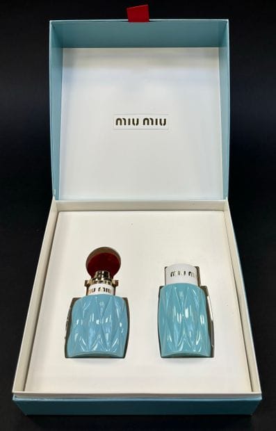 MIU-MIU (2015) 
A festive cardboard box sheathed...