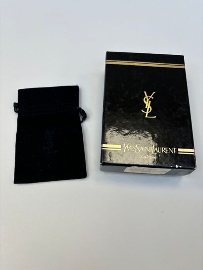 Yves Saint Laurent 
Set featuring a gilded...