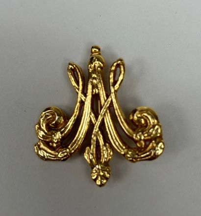 RMN 
Set of two engraved gilt metal brooches...