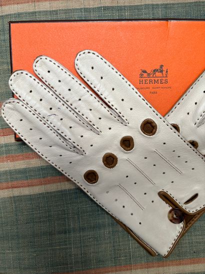 Hermès Paris
Pair of beige lambskin gloves...