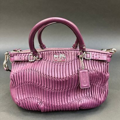 Coach
Purple pleated leather bag.
Double...