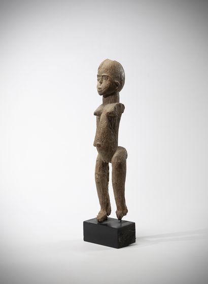 Elegant female statue in heavy, weathered...