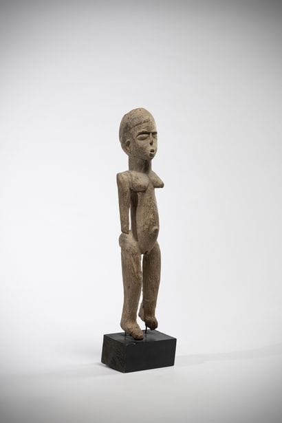 Elegant female statue in heavy, weathered...