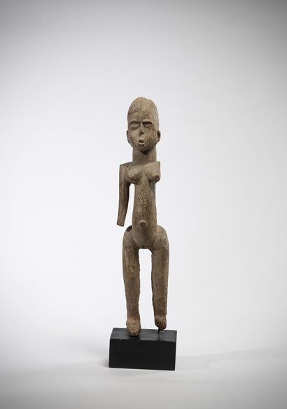 Elegant female statue in heavy, weathered...