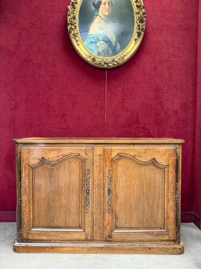 Light-wood sideboard
Opens with two doors...