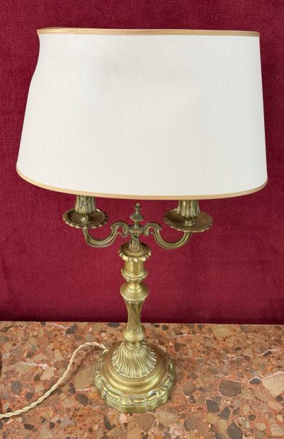 Two-light candelabra 
Made of chiseled and...
