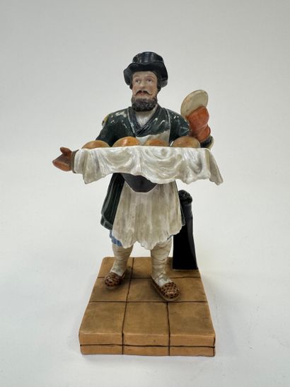 Le Vendeur de pains.
Figurine en porcelaine...
