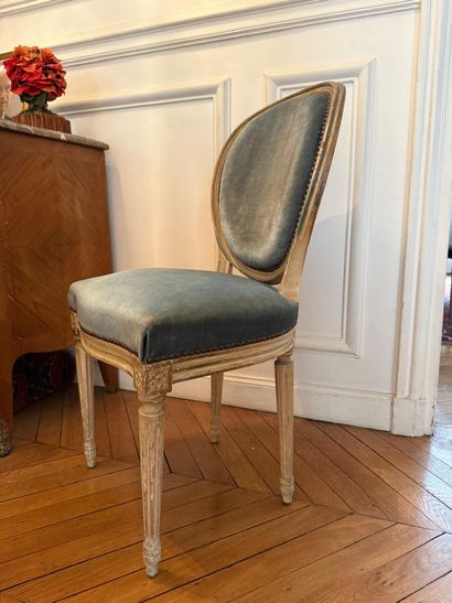 Set of four chairs 
Carved wood, gray lacquered
Louis...