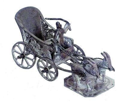 Voiture à chèvre attelée de deux chèvres....