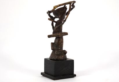 Bronze. Brown patina sculpture of a figure....