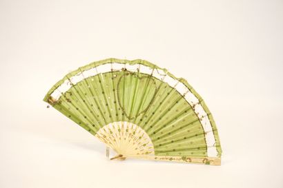Fan circa 1900. Ivory and green silk.