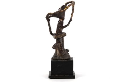 Bronze. Brown patina sculpture of a figure....