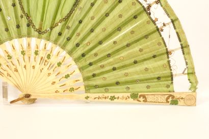 Fan circa 1900. Ivory and green silk.