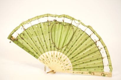 Fan circa 1900. Ivory and green silk.