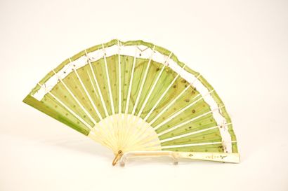 Fan circa 1900. Ivory and green silk.