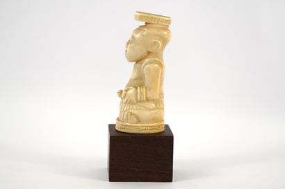 African bone sculpture on base. Democratic...