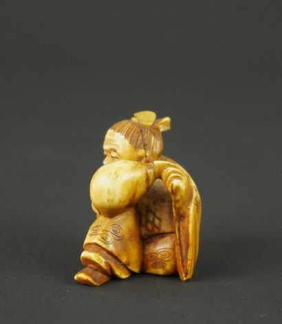 NETSUKE. Ivoire. Japon, fin de l'ère Meiji.
Enfant...