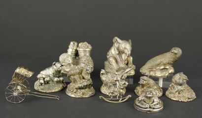 Miniature set of 11 silver-plated metal figurines....