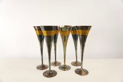 Six silver- and gilt-metal flutes. H 23.5...