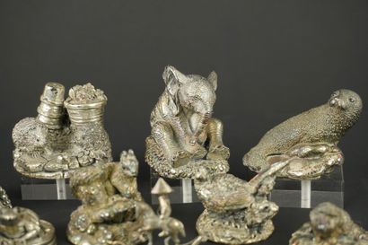 Miniature set of 11 silver-plated metal figurines....
