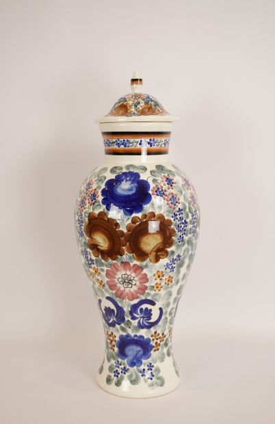 Ceramic. Large covered vase dominated by...