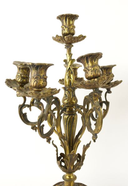Bronze mantelpiece.
Clock and its two six-light...
