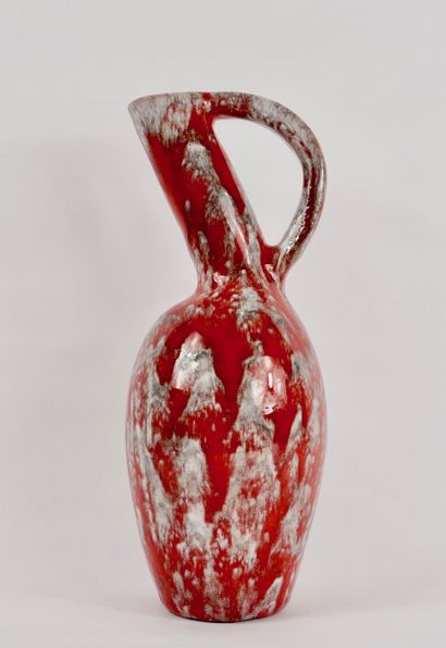 Roux workshop. Ceramic pitcher with red drips....