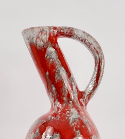 Roux workshop. Ceramic pitcher with red drips....