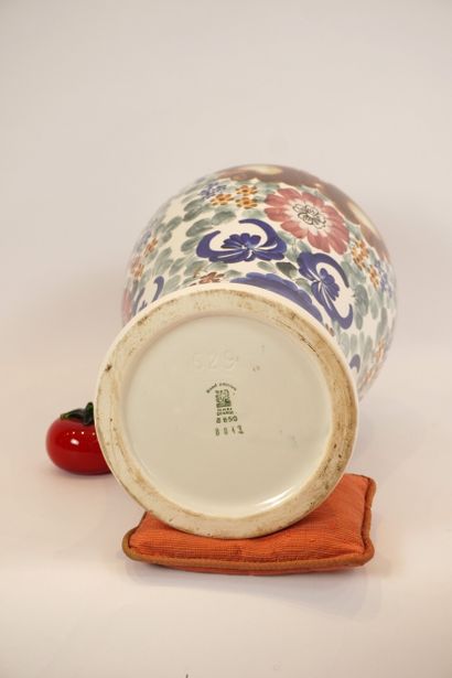Ceramic. Large covered vase dominated by...
