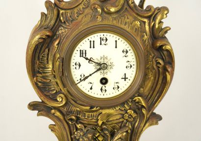 Bronze mantelpiece.
Clock and its two six-light...