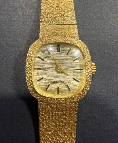 INCABLOC. Montre dame en or. 
Marque 