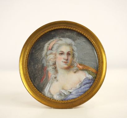 Miniature in a round brass or bronze frame....