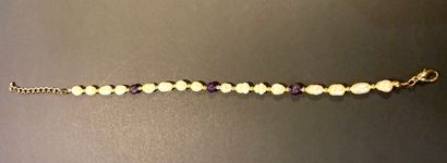 Collier et bracelet en perles ovales difformes...