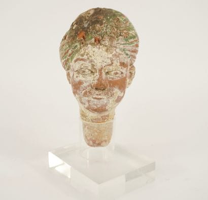 Terracotta figure head mounted on Plexiglas....
