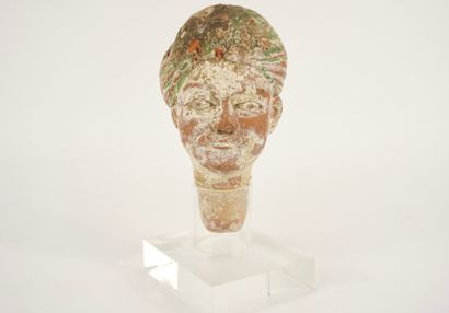 Terracotta figure head mounted on Plexiglas....