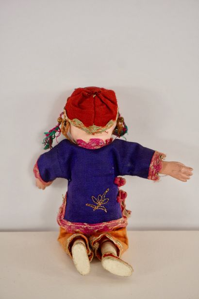 Dolls. Two antique dolls. 
One from Asia...