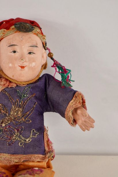 Dolls. Two antique dolls. 
One from Asia...