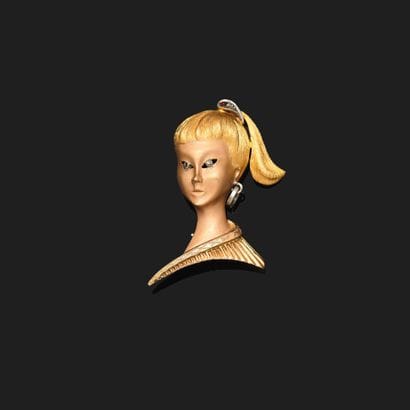 Brooch in 18K (750°°°) yellow gold featuring...
