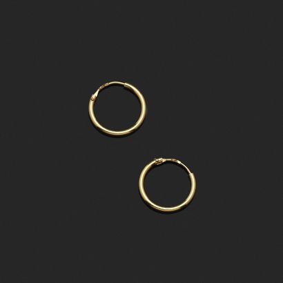 Pair of small hoop earrings in 18K yellow...