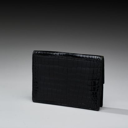 Black crocodile-effect leather clutch. 
Gilded...