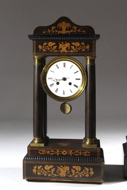 A pair of blackened wood-veneered portal...
