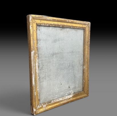 Miroir à encadrement en bois mouluré, sculpté...