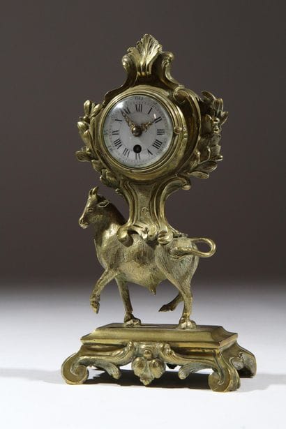 Gilded and chiseled bronze bull-shaped clock...