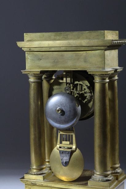 A chiseled and gilded bronze four-column...