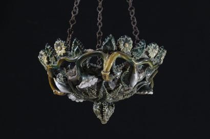 A basket-shaped hanging lamp made of glazed...