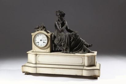 Bronze and white marble clock decorated with...