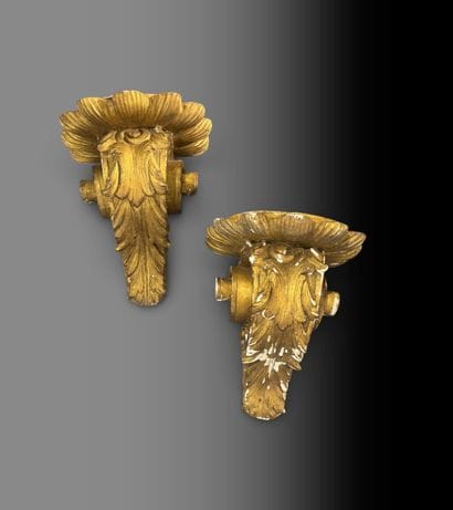 Pair of stuccoed and gilded wooden wall sconces...